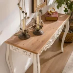Goldoma French vintage carved distressed white console table in entryway with decor