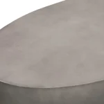 Goldoma 28 inch gray and brass oval coffee table with concrete top in a modern living room
