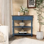 Goldoma solid wood corner table in navy blue with three tiers in a living room corner