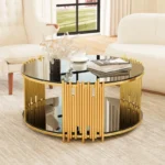 Modern circular coffee table with stainless steel base and tempered glass top on wooden floor
