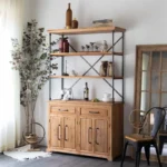 Antique wine bar cabinet with solid wood and iron finish, displaying wine bottles and barware in a living room