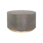 Goldoma 28 inch gray and brass oval coffee table with concrete top in a modern living room