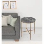 Goldoma 23-inch round end table with brass base and gray marble top in living room