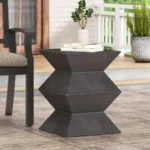Goldoma lightweight concrete outdoor side table with geometric design on a patio