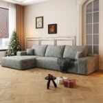 Modular corduroy L-shape sofa bed in a modern living room, showing corner placement and foldable sleeper feature.