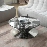 Goldoma modern marbling wood coffee table with round wood top and stainless steel base in a living room