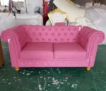 Goldoma PU Leather Chesterfield sofa set in modern living room with tufted back and aluminum legs