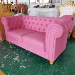 Goldoma PU Leather Chesterfield sofa set in modern living room with tufted back and aluminum legs