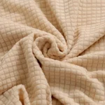Goldoma stretch armchair slipcover with zipper in a living room, showing a snug fit on a standard armchair