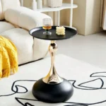 Goldoma modern side table with light grey iron frame placed in a living room corner