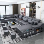 Goldoma U-shaped sectional sofa with built-in Bluetooth speakers and chaise lounge in a modern living room