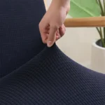 Goldoma stretch armchair slipcover with zipper in a living room, showing a snug fit on a standard armchair