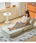 Goldoma Folding Lazy Sofa Chair in modern living room with corduroy or leather upholstery, small space