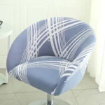 Goldoma semi-circular chair cover on a curved dining chair – stretch knit slipcover protects and decorates