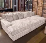 Goldoma white L-shaped velvet sofa in living room with wood frame and removable covers