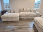 Goldoma white L-shaped velvet sofa in living room with wood frame and removable covers