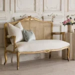 Goldoma French carved wood velvet single sofa in gold fabric with hand-carved details, ideal for living rooms