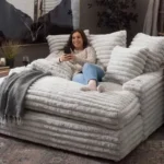 Goldoma white L-shaped velvet sofa in living room with wood frame and removable covers