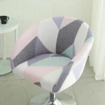 Goldoma semi-circular chair cover on a curved dining chair – stretch knit slipcover protects and decorates