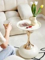 Goldoma modern side table with light grey iron frame placed in a living room corner