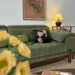 Goldoma Minimalist U-Shape Sectional Sofa in green chenille fabric with sofa bed function for modern living rooms