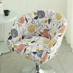 Goldoma semi-circular chair cover on a curved dining chair – stretch knit slipcover protects and decorates