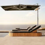 Goldoma outdoor teak sofa set with water-resistant acrylic cushions on a patio
