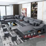 Goldoma U-shaped sectional sofa with built-in Bluetooth speakers and chaise lounge in a modern living room