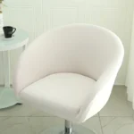 Goldoma semi-circular chair cover on a curved dining chair – stretch knit slipcover protects and decorates
