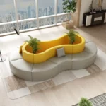 Goldoma modern S-shape PU leather modular sectional sofa set in an office lobby