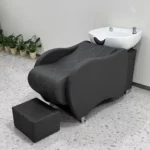 Goldoma luxury shampoo chair with built-in back massage and reclining seat in a modern salon setting