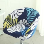 Goldoma semi-circular chair cover on a curved dining chair – stretch knit slipcover protects and decorates