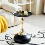 Goldoma modern side table with light grey iron frame placed in a living room corner