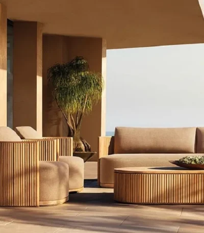 Goldoma outdoor teak sofa set with water-resistant acrylic cushions on a patio