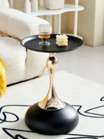Goldoma modern side table with light grey iron frame placed in a living room corner