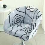 Goldoma semi-circular chair cover on a curved dining chair – stretch knit slipcover protects and decorates