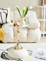 Goldoma modern side table with light grey iron frame placed in a living room corner