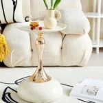 Goldoma modern side table with light grey iron frame placed in a living room corner