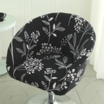Goldoma semi-circular chair cover on a curved dining chair – stretch knit slipcover protects and decorates