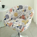 Goldoma semi-circular chair cover on a curved dining chair – stretch knit slipcover protects and decorates