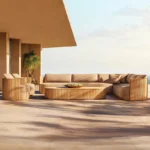 Goldoma outdoor teak sofa set with water-resistant acrylic cushions on a patio