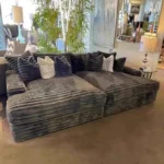 Goldoma white L-shaped velvet sofa in living room with wood frame and removable covers