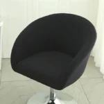 Goldoma semi-circular chair cover on a curved dining chair – stretch knit slipcover protects and decorates