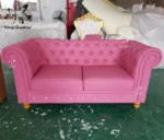 Goldoma PU Leather Chesterfield sofa set in modern living room with tufted back and aluminum legs