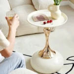 Goldoma modern side table with light grey iron frame placed in a living room corner