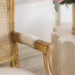 Goldoma French carved wood velvet single sofa in gold fabric with hand-carved details, ideal for living rooms