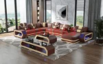 Goldoma genuine leather sectional sofa with LED lighting, storage shelves, USB ports, and cup holders in a modern living room