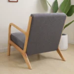 Goldoma stretch armchair slipcover with zipper in a living room, showing a snug fit on a standard armchair