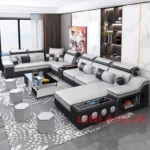 Goldoma U-shaped sectional sofa with built-in Bluetooth speakers and chaise lounge in a modern living room