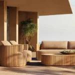 Goldoma outdoor teak sofa set with water-resistant acrylic cushions on a patio